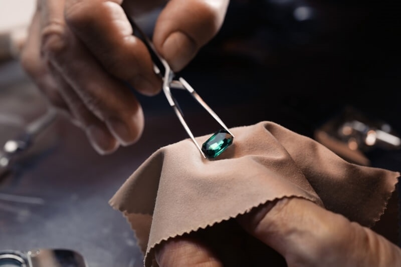 man-checking-gemstone-authenticity
