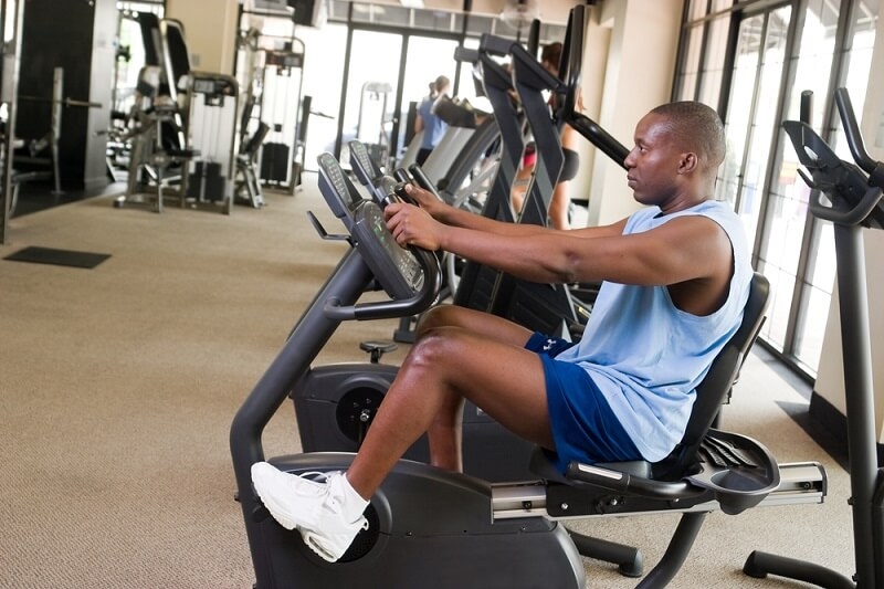 man cycling in gym 