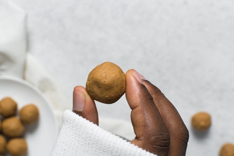 man holding donkwa energy balls