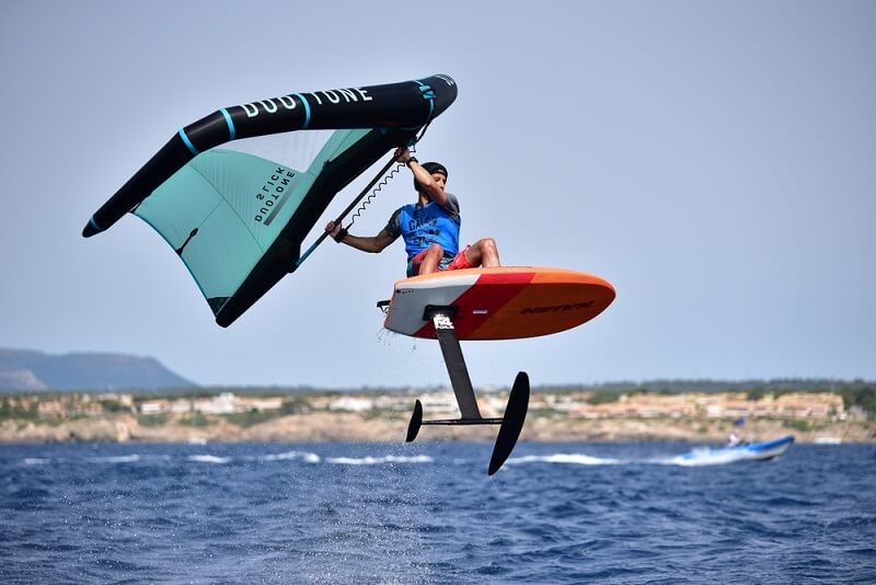 man surfing woth hydrofoil board