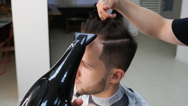 man getting buzz cut