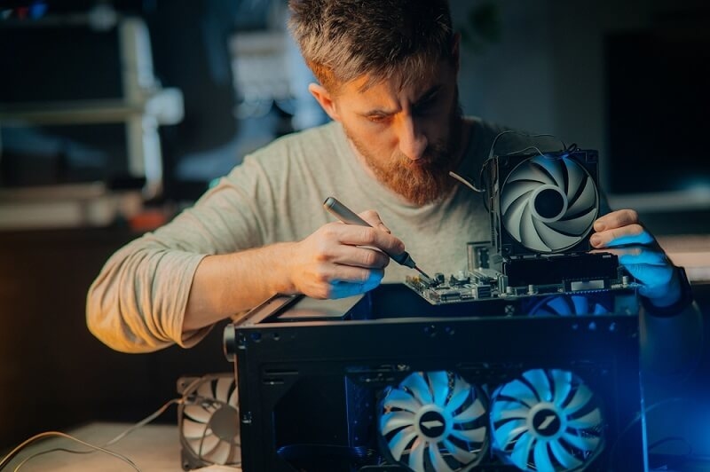 man fixing common motherboard issue