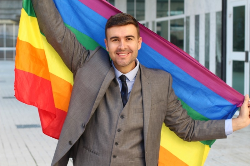 Man holding lgbtq flag