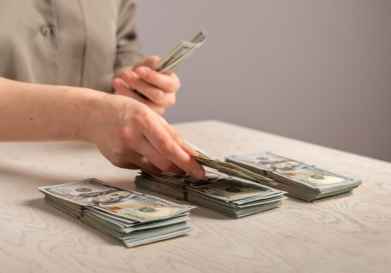 man arranging savings 20 separate while budgeting