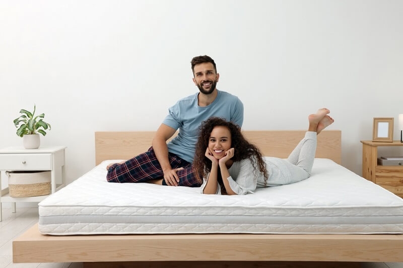couple testing mattress