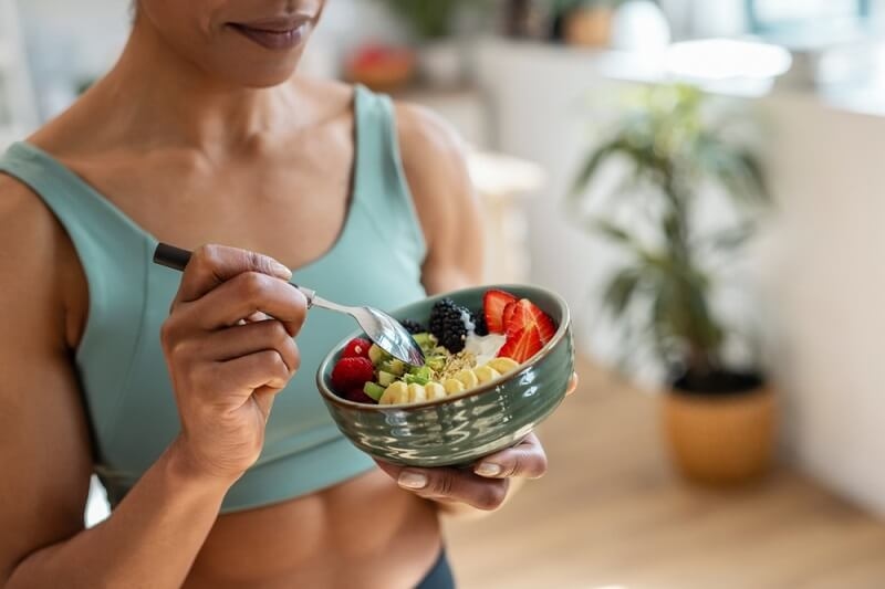 woman eating healthy diet foods in morning diet