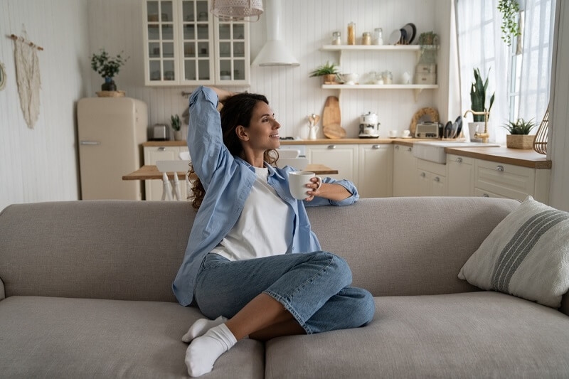 woman sitting and relaxing following mindful technique