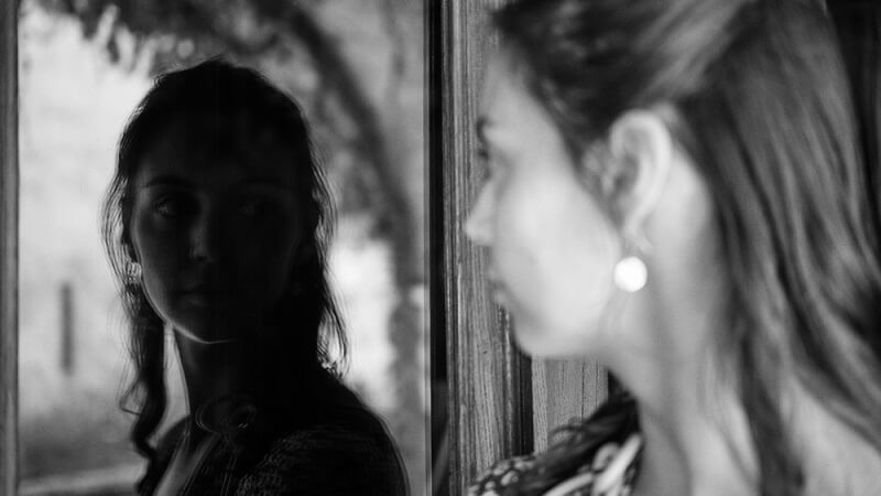 woman doing portrait mirror photo