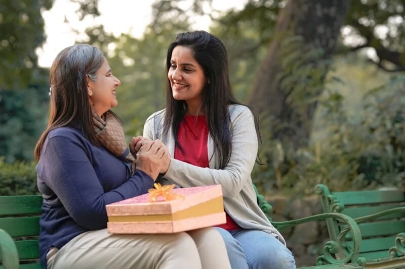 mother feeling happy after getting gift from daughter