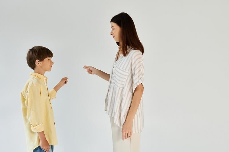woman giving lessons to son