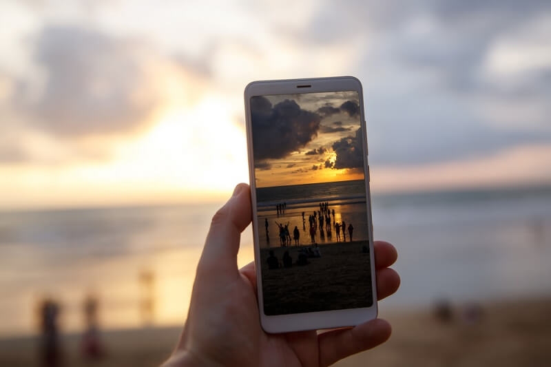 man clicking pictures in natural light in golden hour