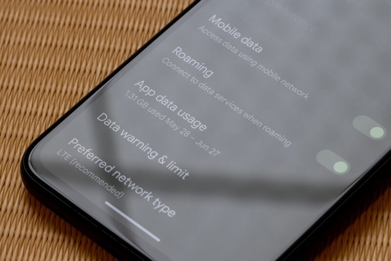 man checking data usage and speed in his smartphone