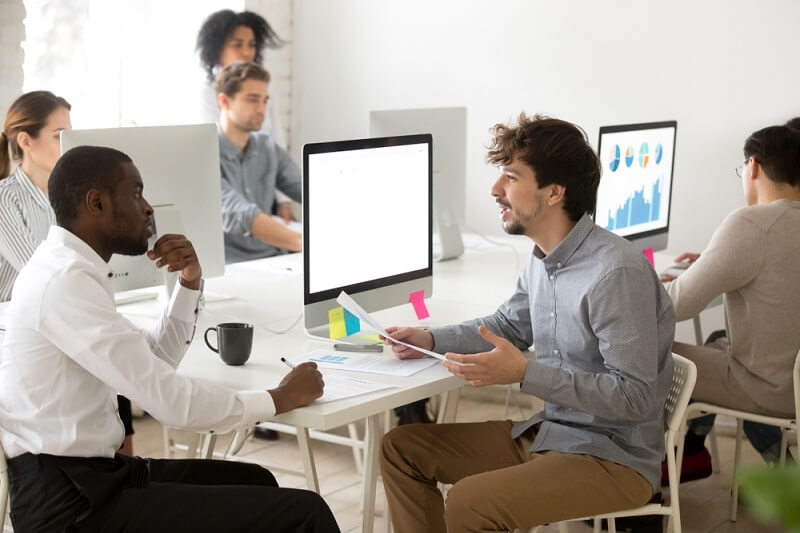 manager giving training sessions to new african hired employee