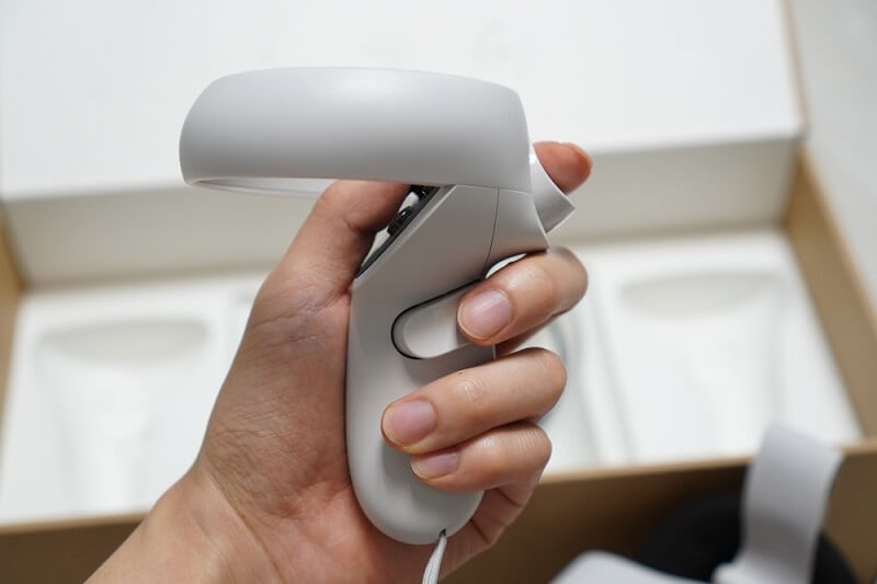 woman hand holding controller of oculus 