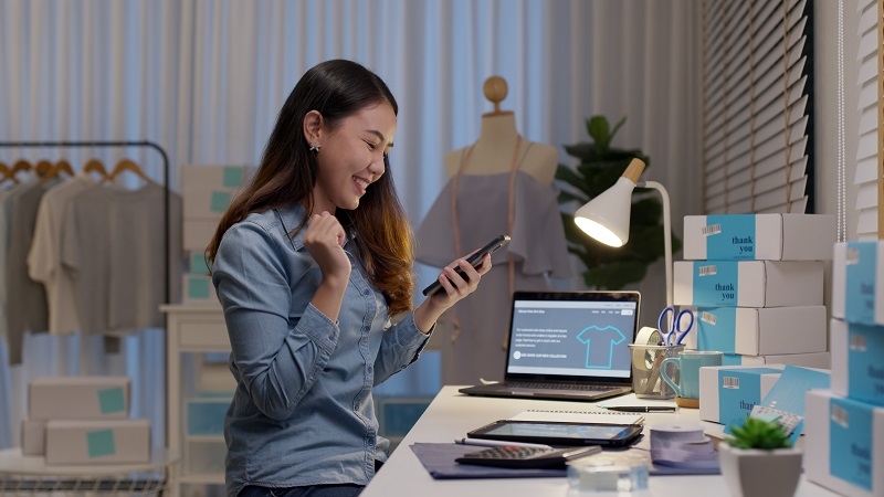 women reading online bank statements