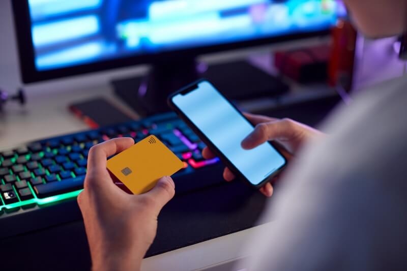 man filling cards information for payments and getting cashback
