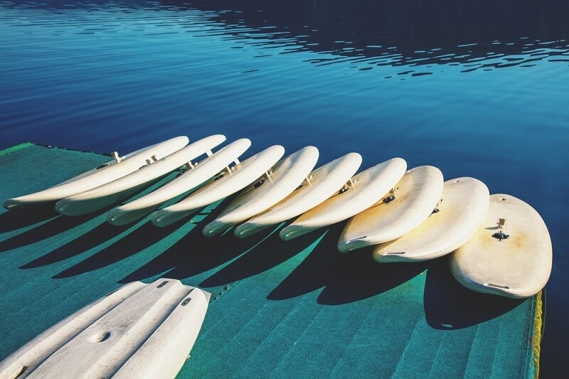 paddle boards on river side