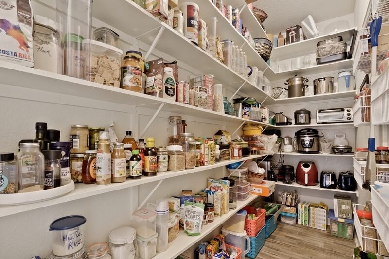 organized shelf by height and type in pantry store 