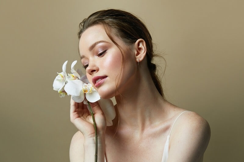 warm and soothing filter on woman with flowers