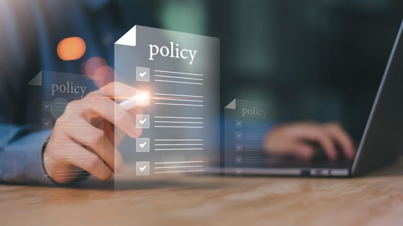 man reading policy of insurance bundling