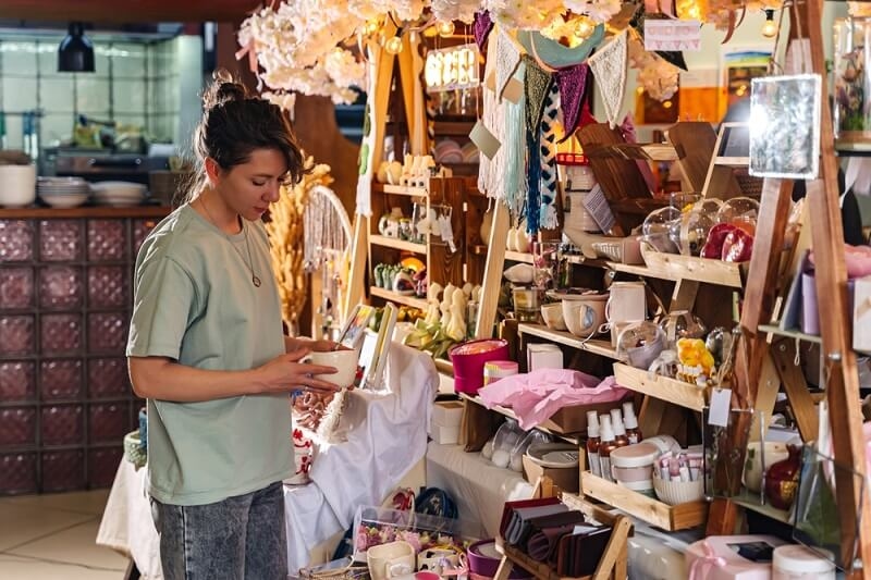 woman buying handmade artistic things 