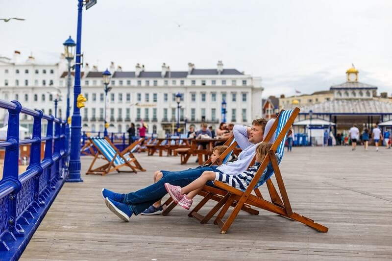 man relaxing on trip with her daughter