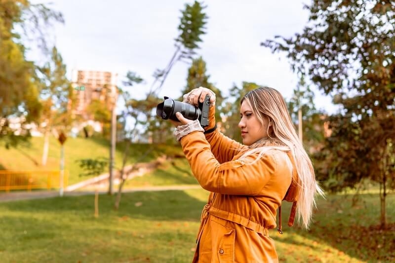 woman photographer clicking picture in vacation