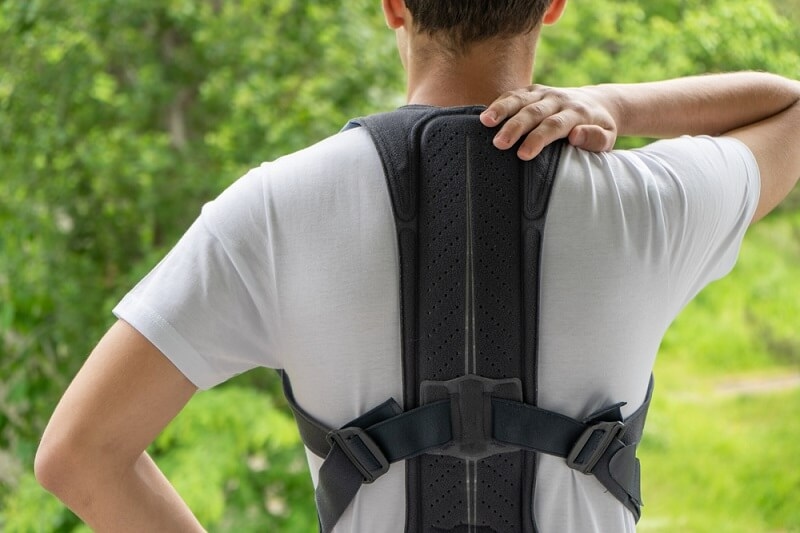 man wearing posture corrector