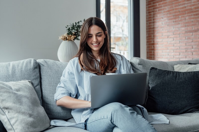 business woman doing work on commercial laptop 