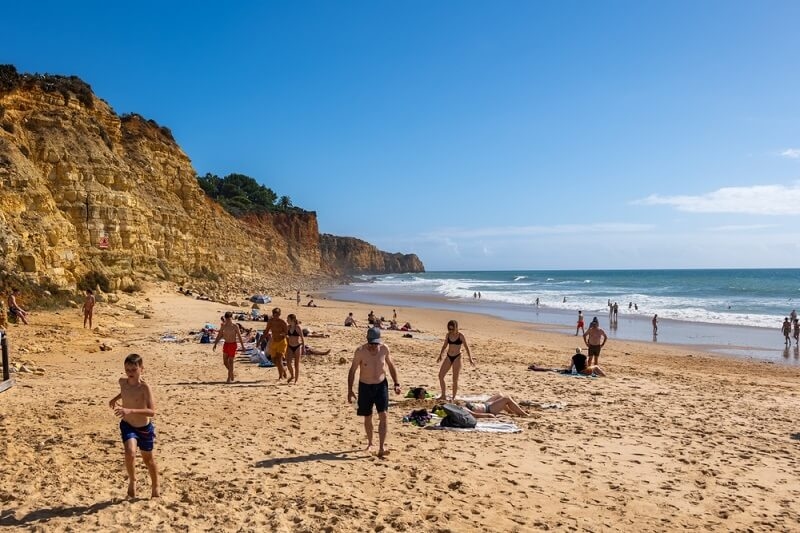 people gathered at algavre beach
