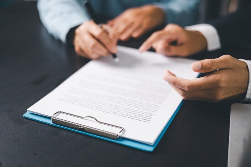 man discussing about insurance premium and deductibles with insurer