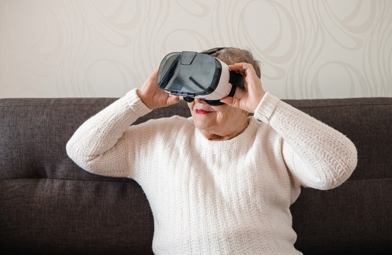 retired-woman-enjoying-vr-headset-gift