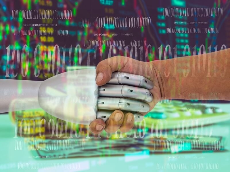 robot handshake with man and stock chart on background
