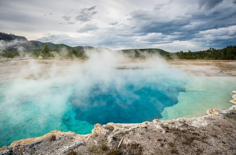 scenic view in yellowstone with blue water pond