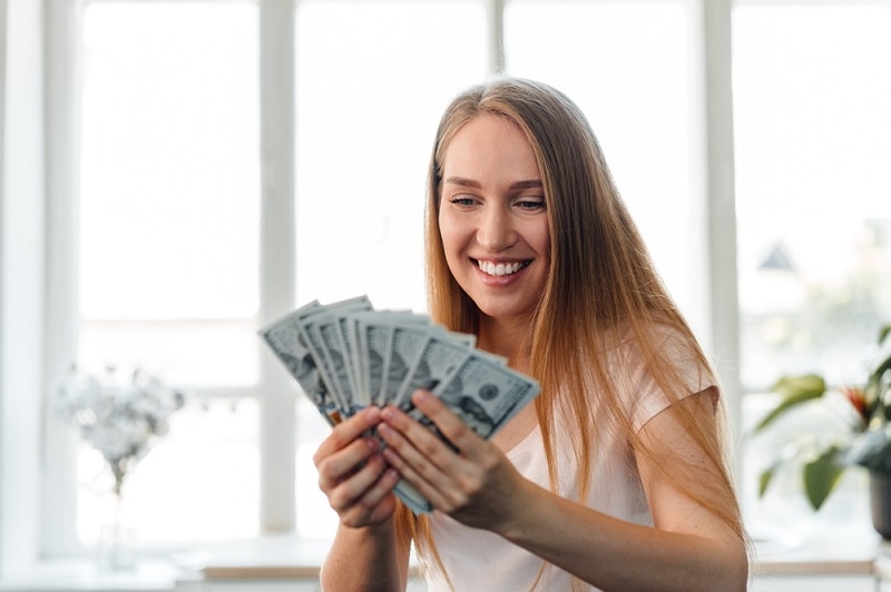 woman holding cash