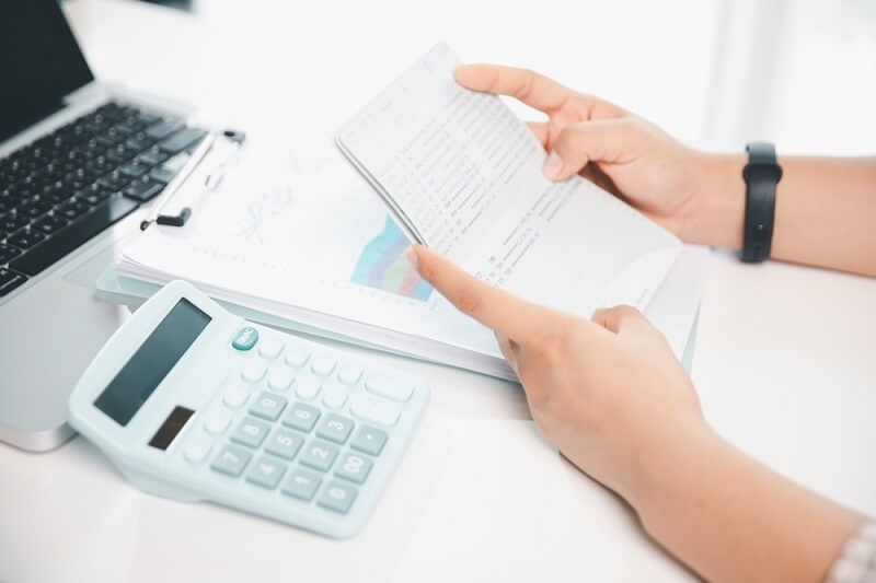 man checking statements of savings account