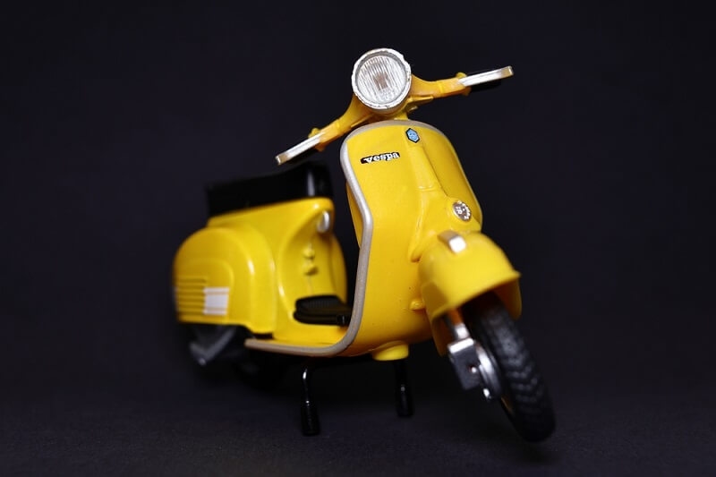 die cast yellow color vespa scooter 