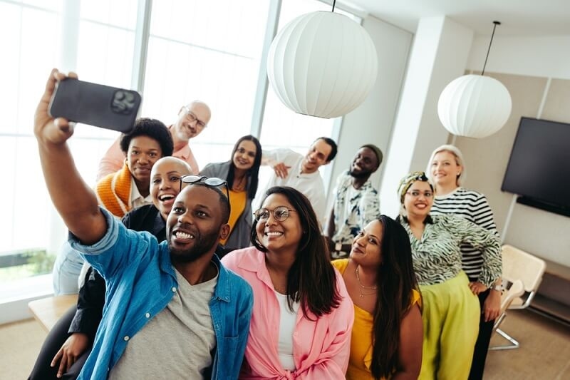 office employees taking selfie after activities in office