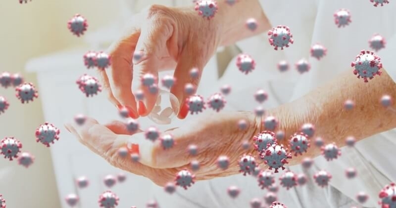 seniors-hand-holding-pills-to-boos-immunity