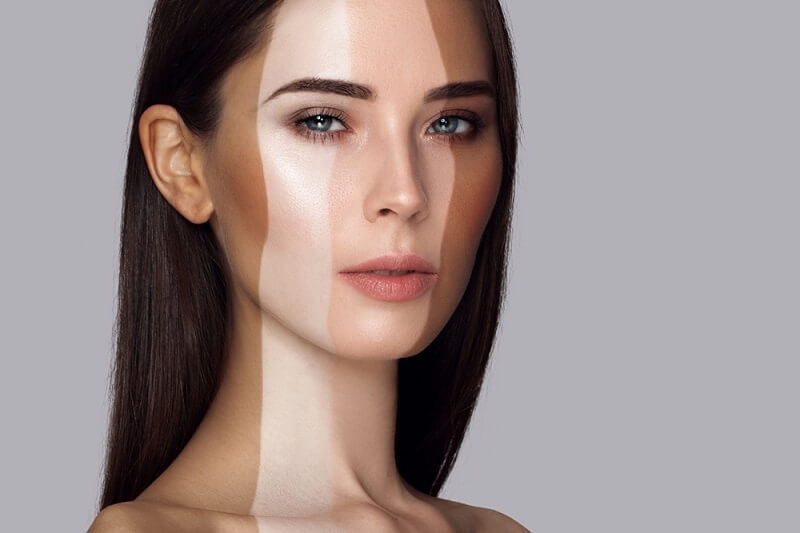 woman applied different shades of foundation on her face