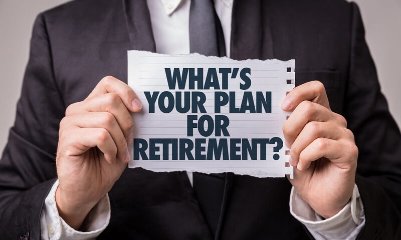 man holding pension retirement plan text paper slip