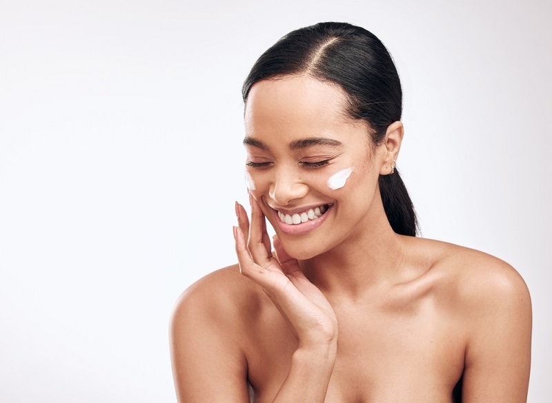 woman Moisturizing her skin