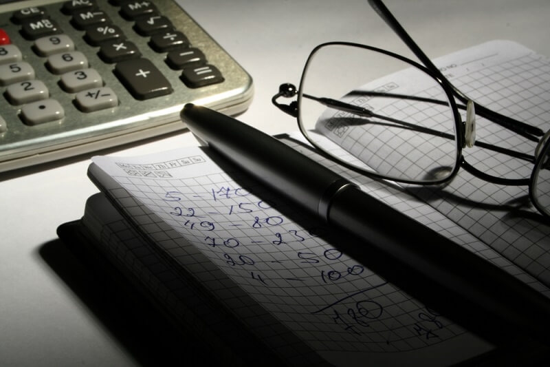 slash expenses on diary and calculator