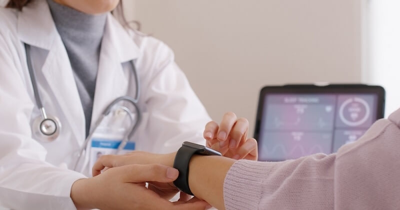 AI Driven smart sleep tracker installed by doctor on woman hand