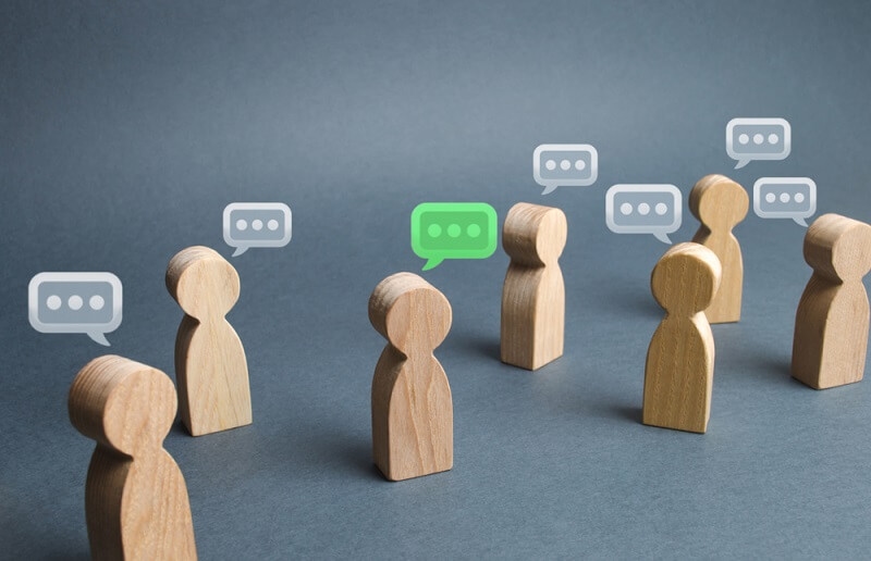 wooden  blocks as people messaging each other