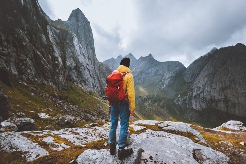 solo traveler young man in mountains
