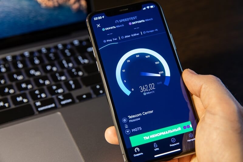 person checking internet speed in speed test tool by okla in smartphone