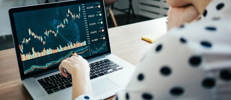 woman looking at stocks reports