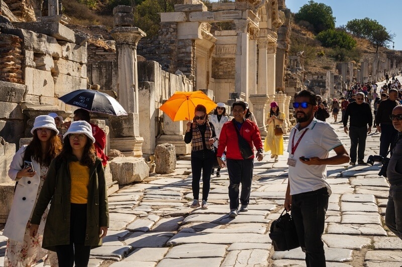 people roaming around in hot weather