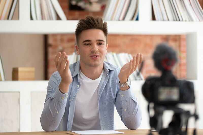 teen boy recording himself for boosting confidence